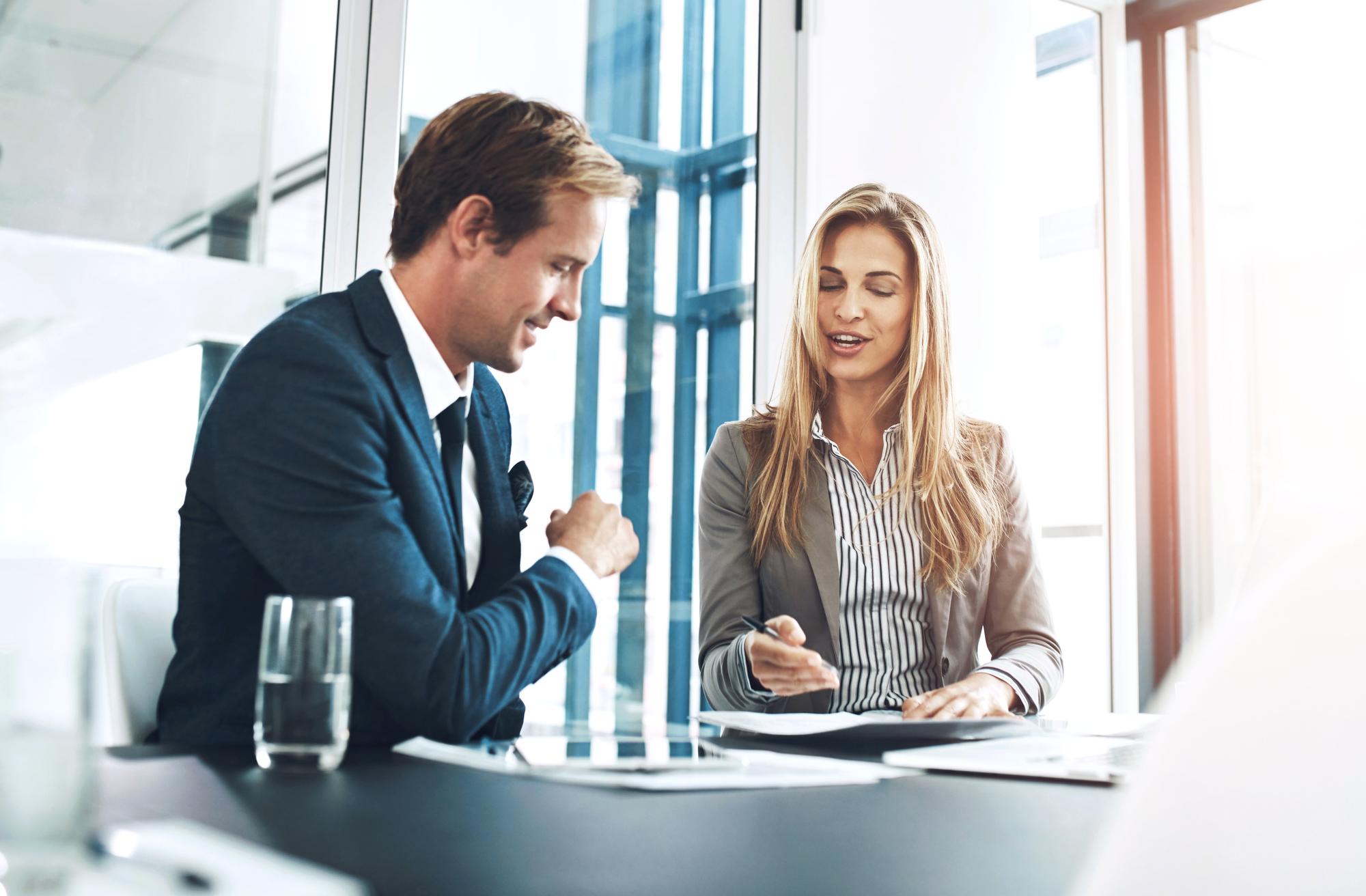 Lawyer preparing real estate transaction documents and property agreement paperwork